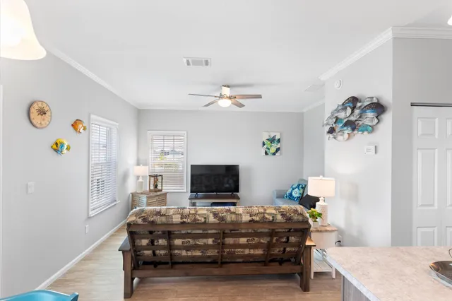 a kitchen with a refrigerator and a stove top oven