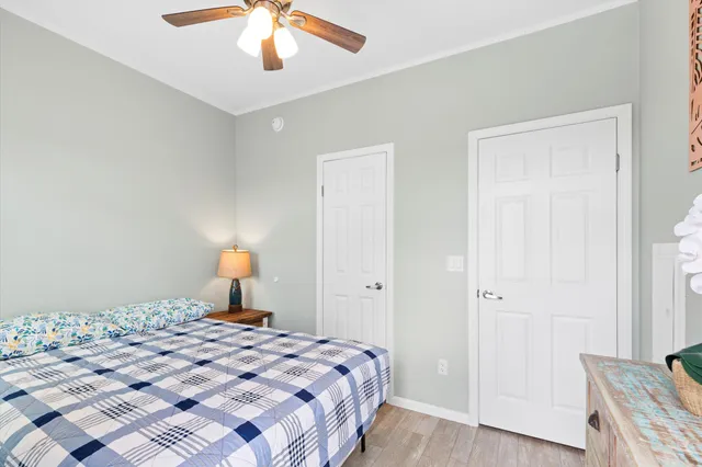 a bedroom with a bed and a dresser