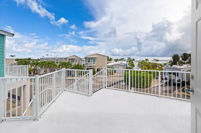 an aerial view of a house with a lake view