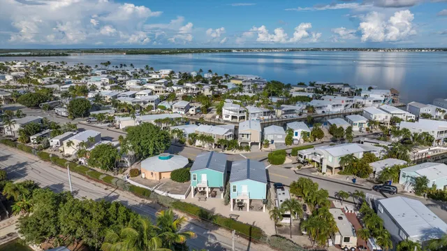 an aerial view of residential houses with outdoor space