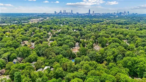 an aerial view of a houses with a yard