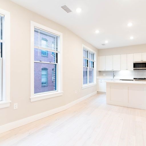 197 Green Street, Unit 303 Boston, MA 02130 - Photo 4 of 6 a view of kitchen with stainless steel appliances cabinets