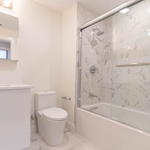 197 Green Street, Unit 303 Boston, MA 02130 - Photo 6 of 6 a bathroom with a toilet and a bathtub