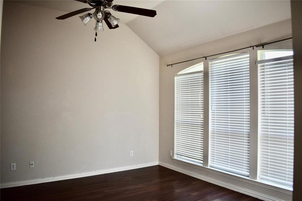 384 Spring Meadow Drive Fairview, TX 75069 - Photo 6 of 16 wooden floor in an empty room with a window