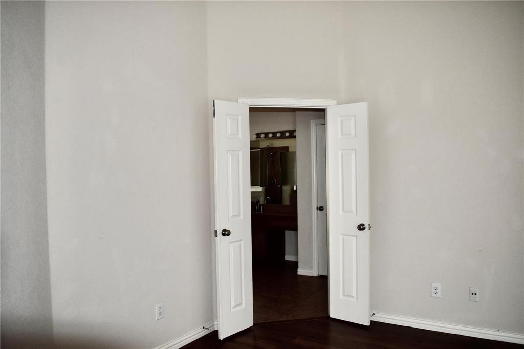 384 Spring Meadow Drive Fairview, TX 75069 - Photo 7 of 16 a view of a hallway with wooden floor