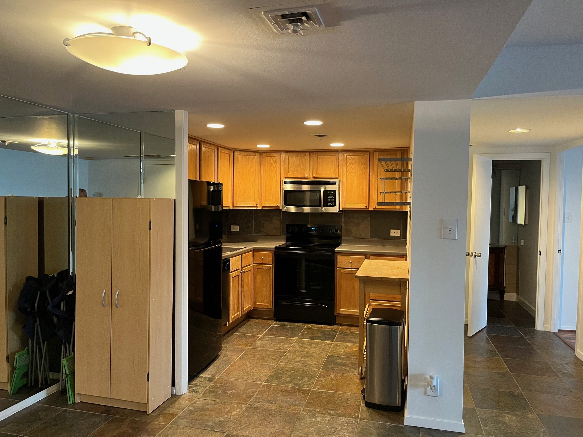 2016 Main Street, Unit 1005 Houston, TX 77002 - Photo 2 of 8 a kitchen with refrigerator and cabinets