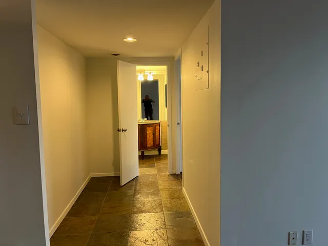 a view of a hallway with a room