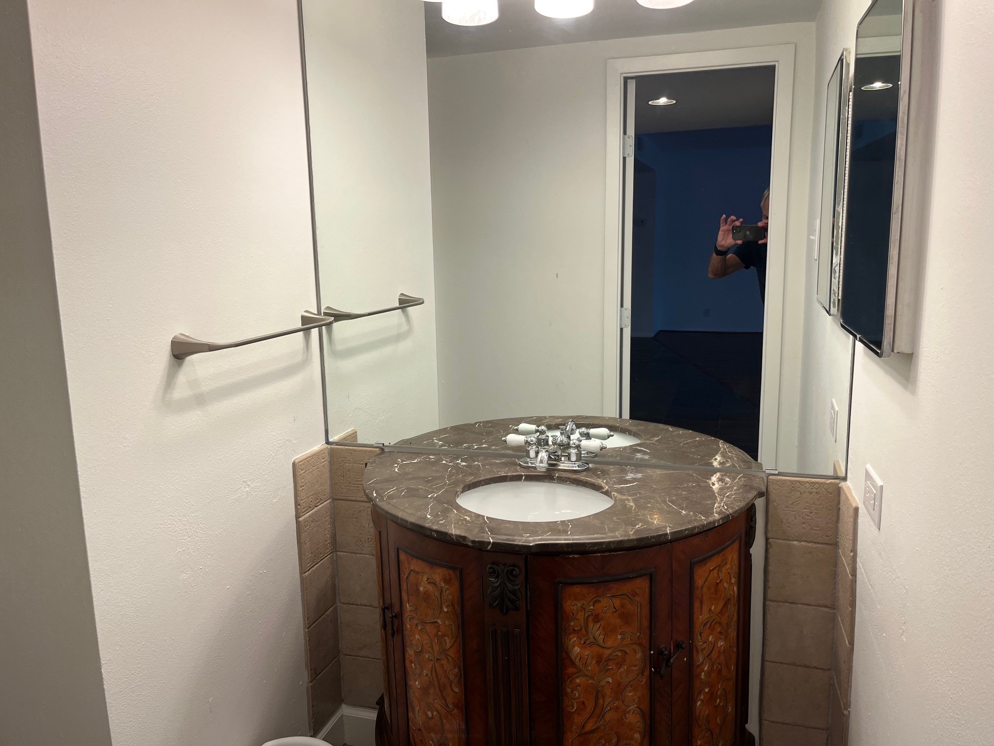 2016 Main Street, Unit 1005 Houston, TX 77002 - Photo 7 of 8 a bathroom with a sink and a mirror