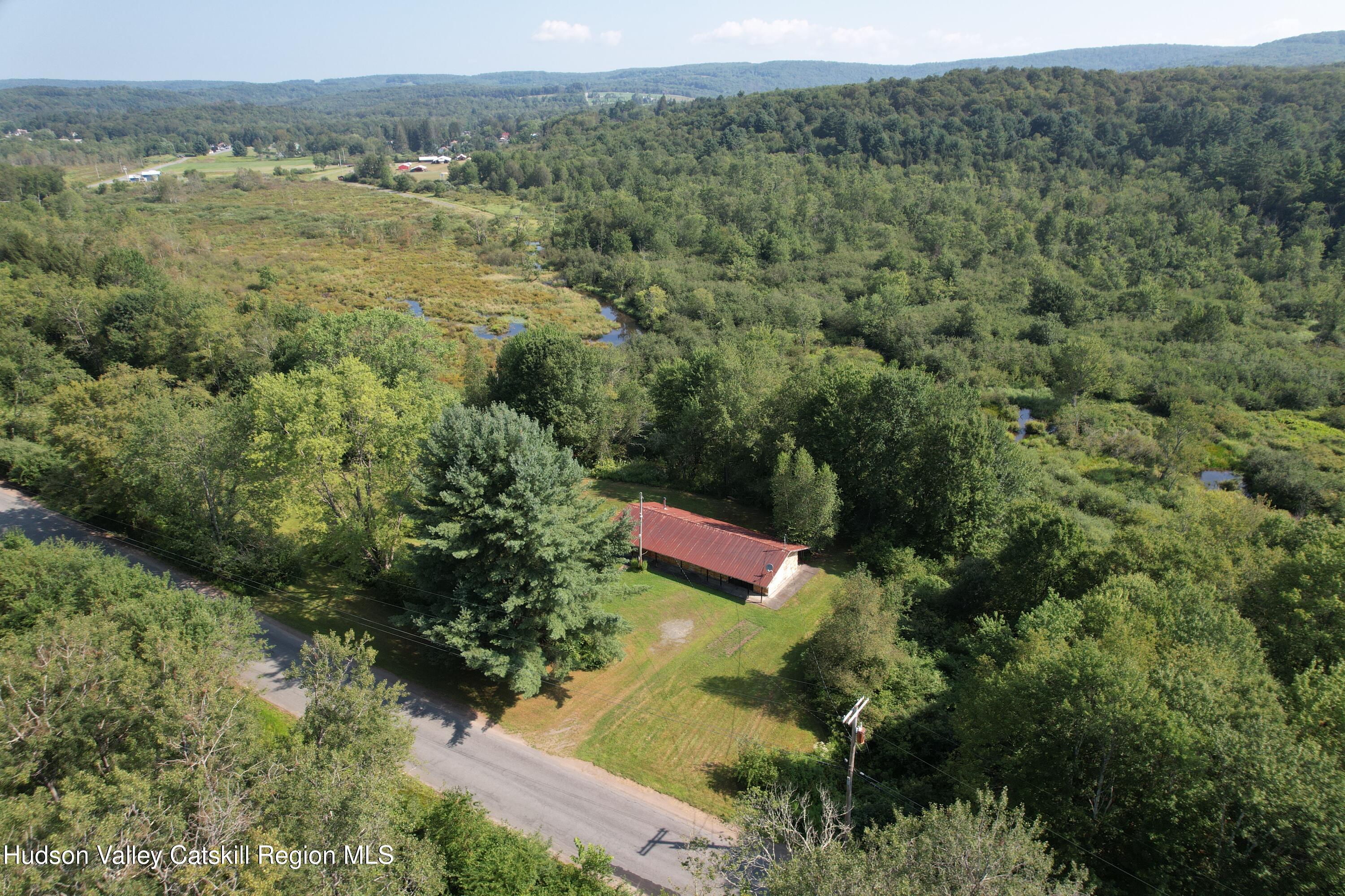 an aerial view of a house with a yard
