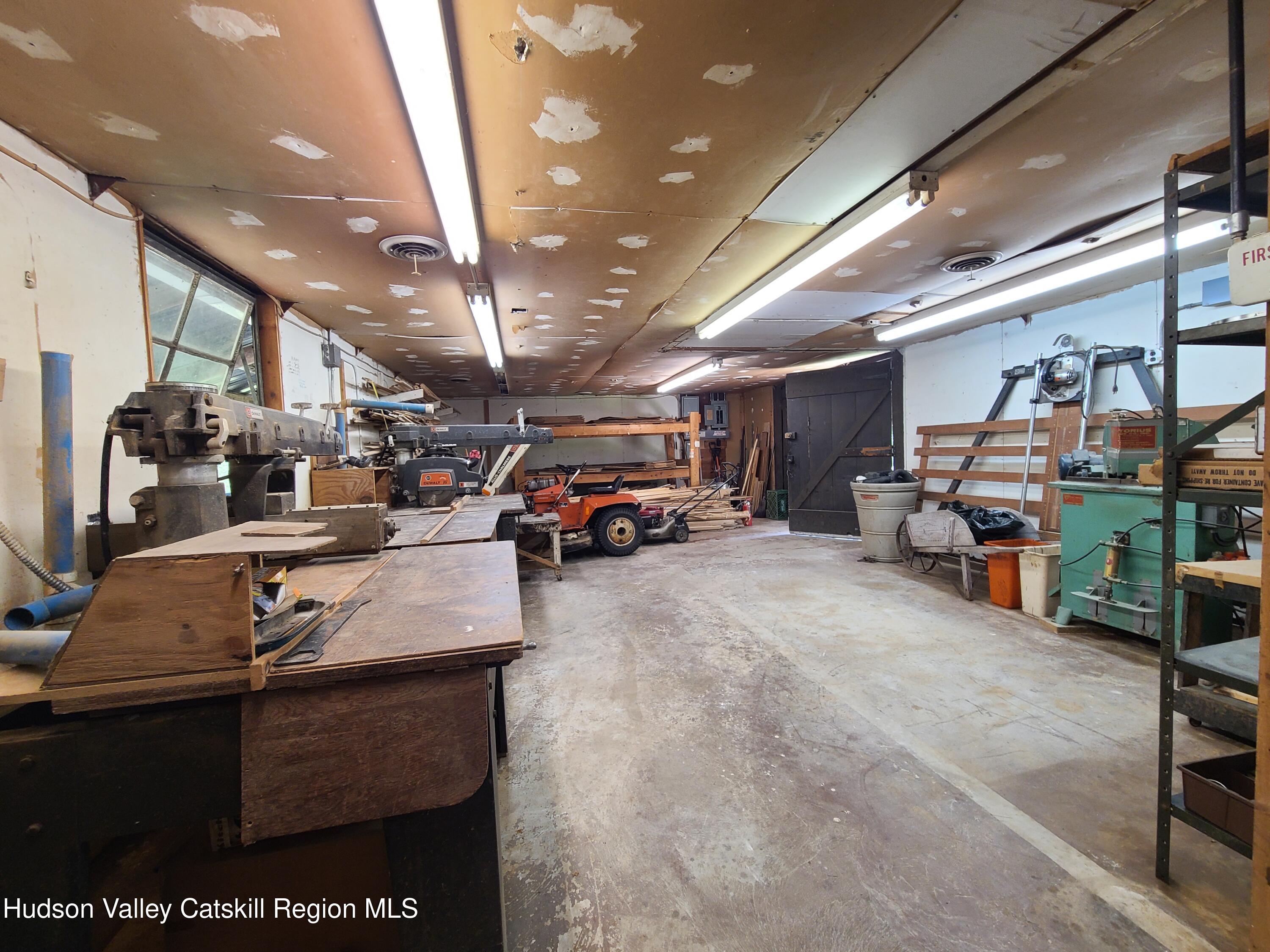 153 Shore Road Swan Lake, NY 12783 - Photo 11 of 45 a view of parking garage with cars