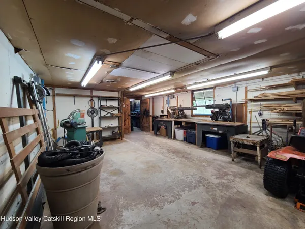 a room with lots of furniture and clutter