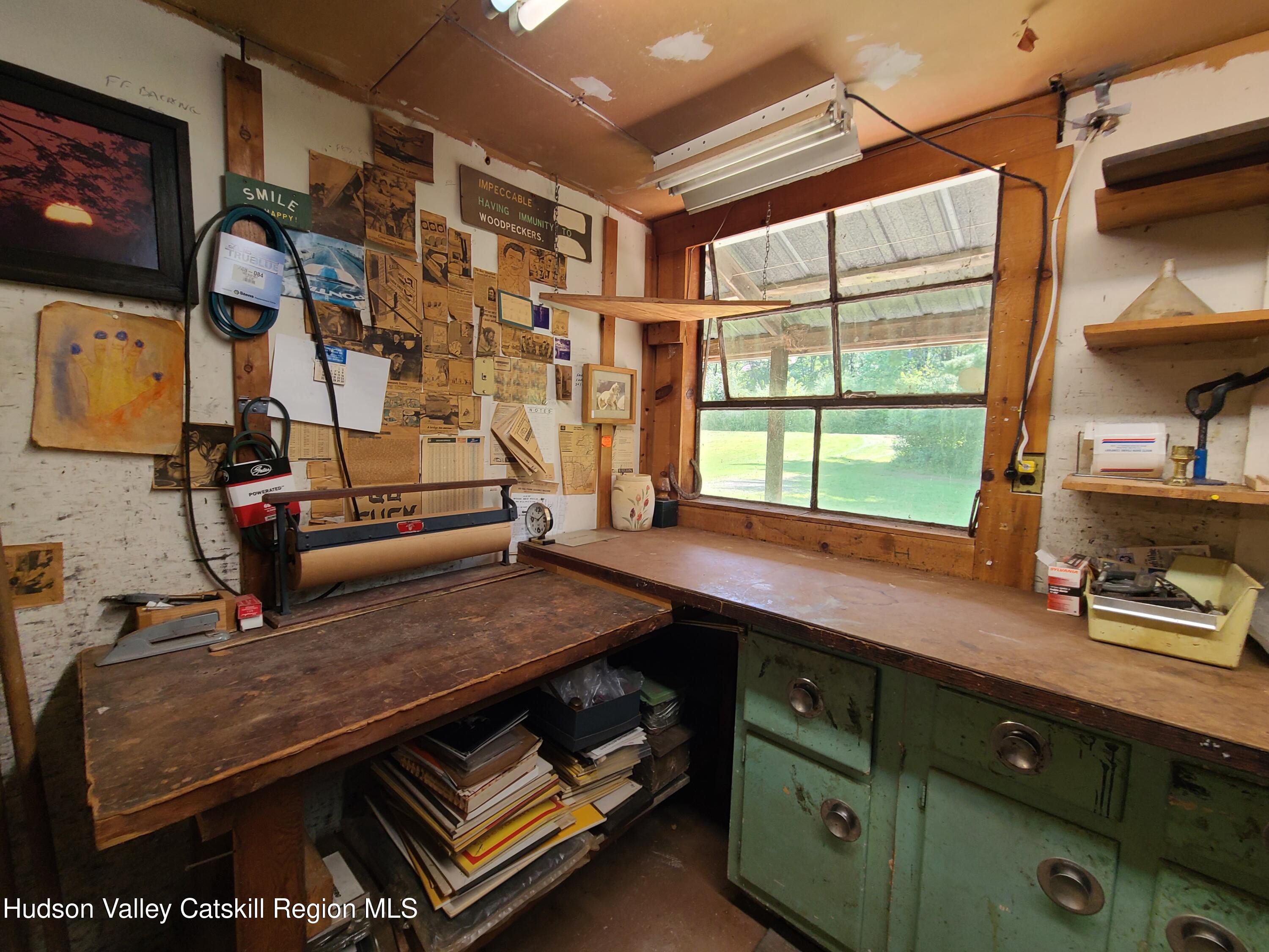 153 Shore Road Swan Lake, NY 12783 - Photo 26 of 45 a room with gym equipment and a window