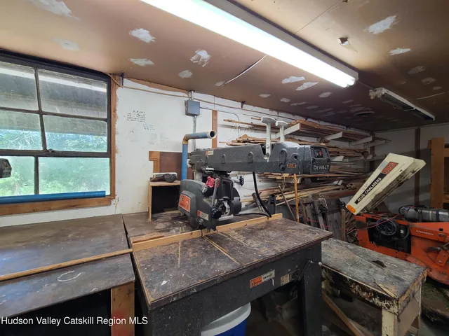 a room with lots of wooden furniture and a wooden roof