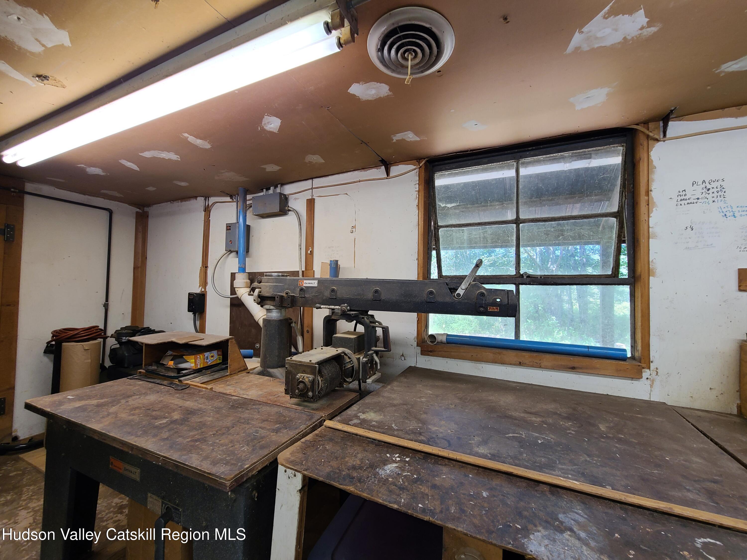 153 Shore Road Swan Lake, NY 12783 - Photo 30 of 45 a room with gym equipment and a large window