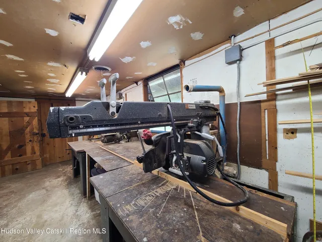 a kitchen with a sink a refrigerator and washer
