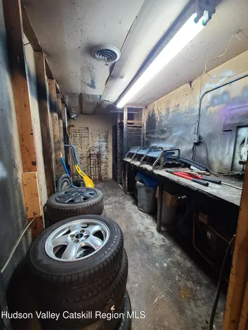 a bathroom with a toilet and a mirror