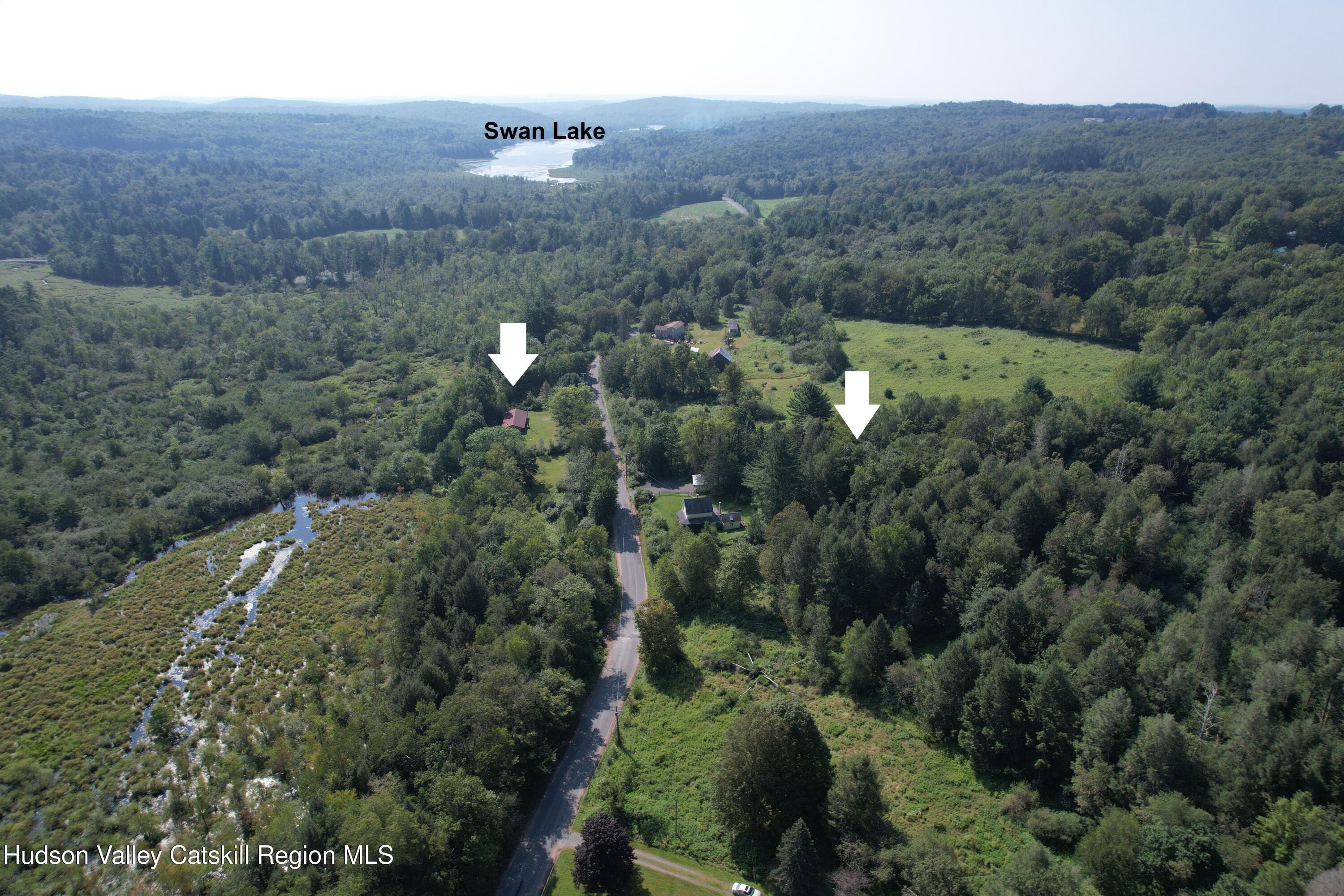 153 Shore Road Swan Lake, NY 12783 - Photo 5 of 45 an aerial view of multiple house
