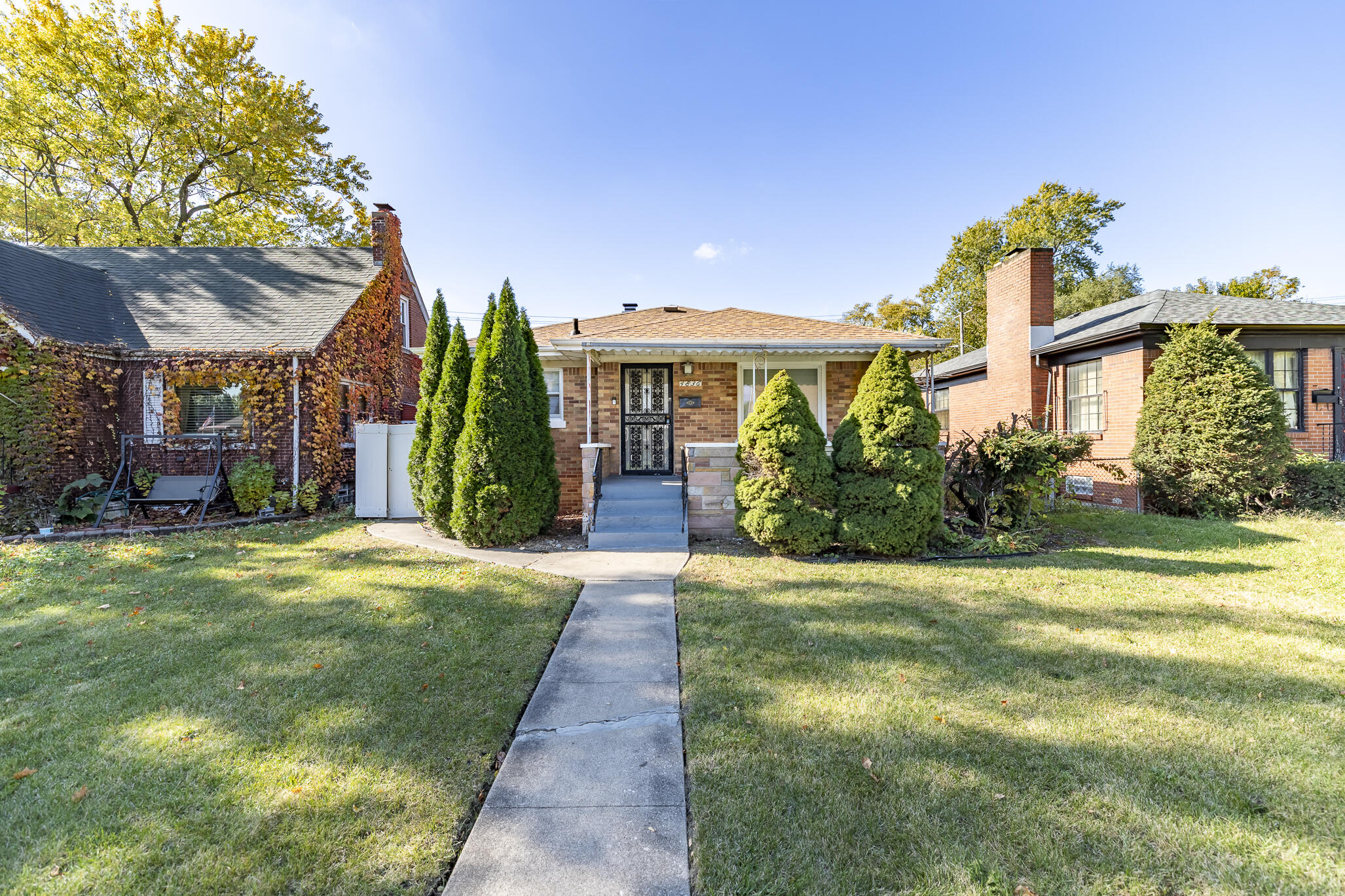 4836 Madison Street Gary, IN 46408 - Photo 1 of 21 a front view of a house with garden