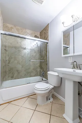 a view of a room with wooden floor and windows