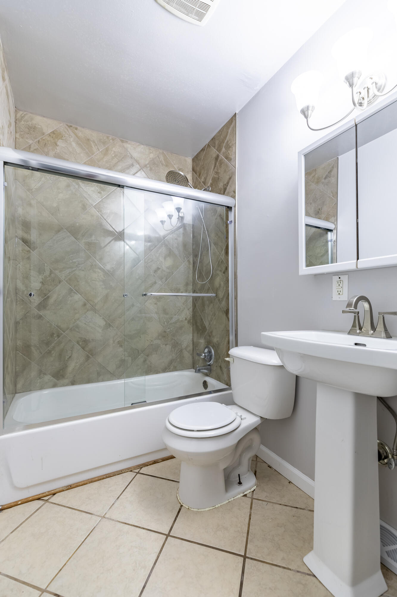 4836 Madison Street Gary, IN 46408 - Photo 13 of 21 a bathroom with a sink a toilet and a bathtub