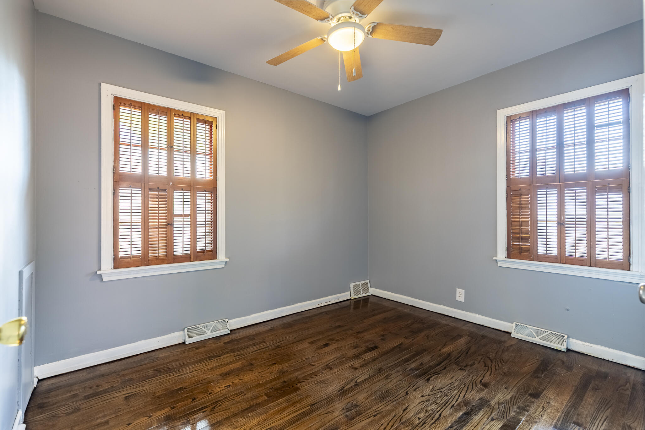 4836 Madison Street Gary, IN 46408 - Photo 16 of 21 a view of an empty room with wooden floor and a window