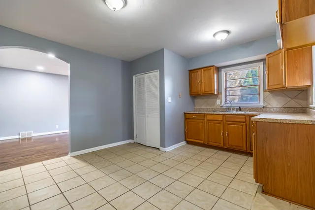 a kitchen with stainless steel appliances a sink and cabinets