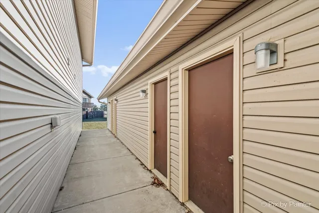 front view of a brick house with a garage