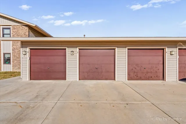 a view of a house with wooden fence
