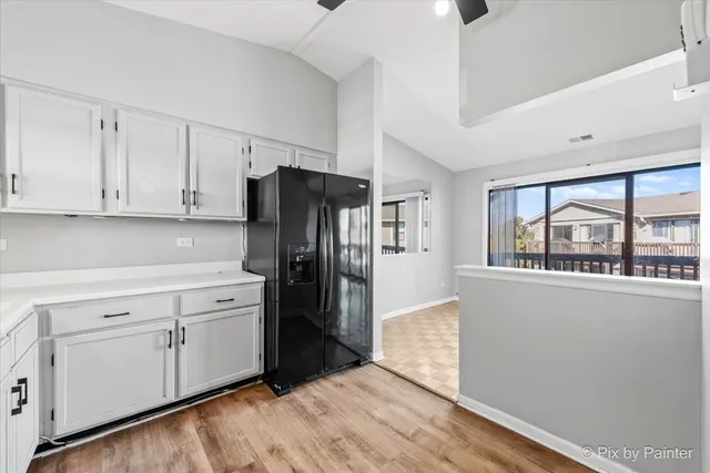 a kitchen with stainless steel appliances a refrigerator sink and cabinets
