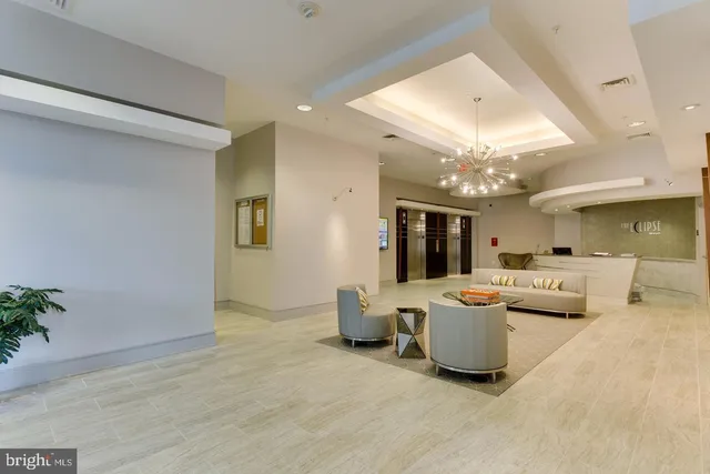a view of a livingroom with furniture and a chandelier