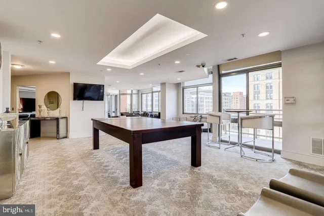 a living room with furniture and a table