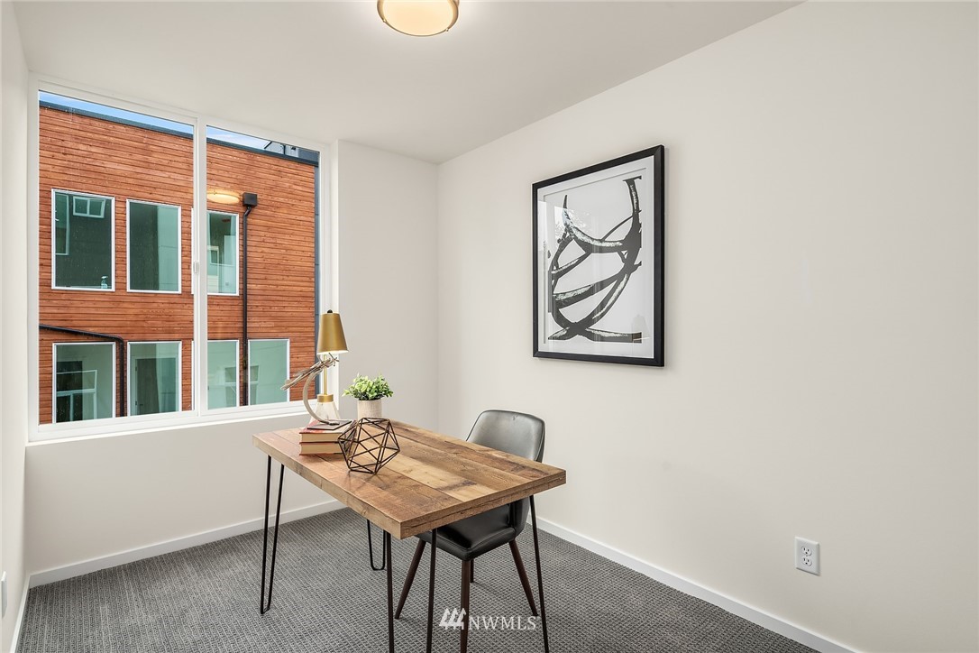 13735 35th Avenue Northeast, Unit B Seattle, WA 98125 - Photo 12 of 20 a view of a room that has a table and chair