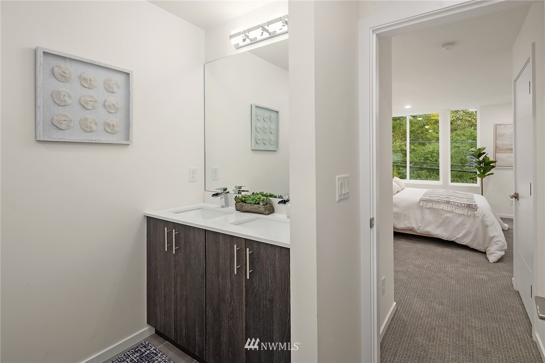 13735 35th Avenue Northeast, Unit B Seattle, WA 98125 - Photo 15 of 20 a en suite bathroom with a sink and a mirror