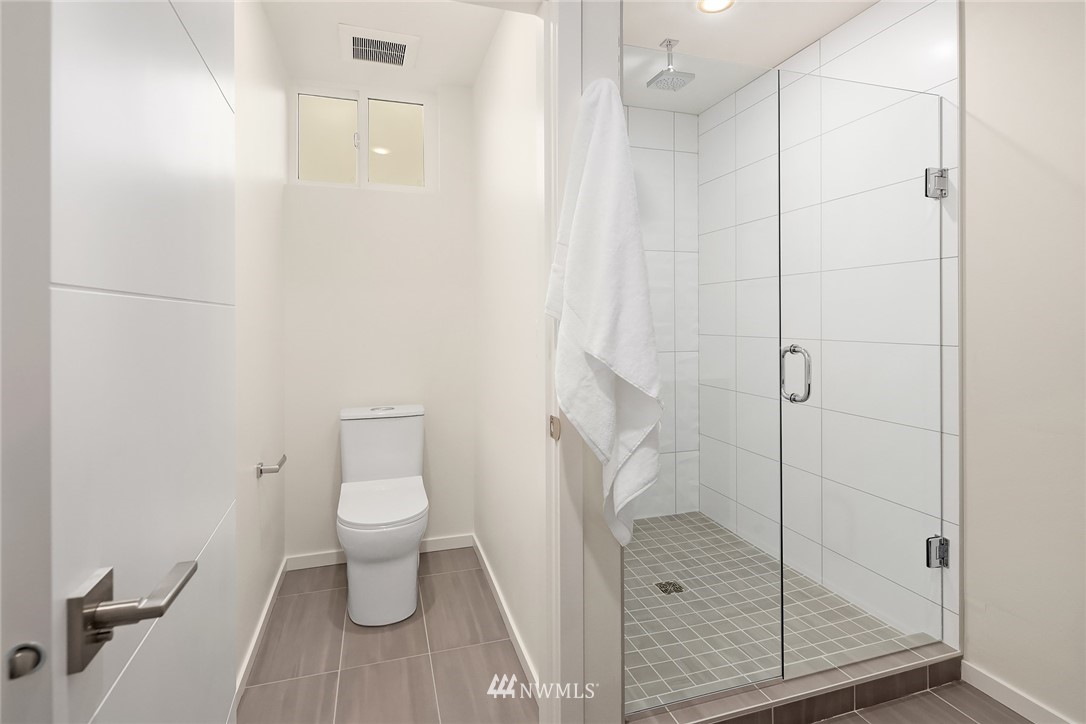 13735 35th Avenue Northeast, Unit B Seattle, WA 98125 - Photo 16 of 20 a bathroom with a toilet and a shower