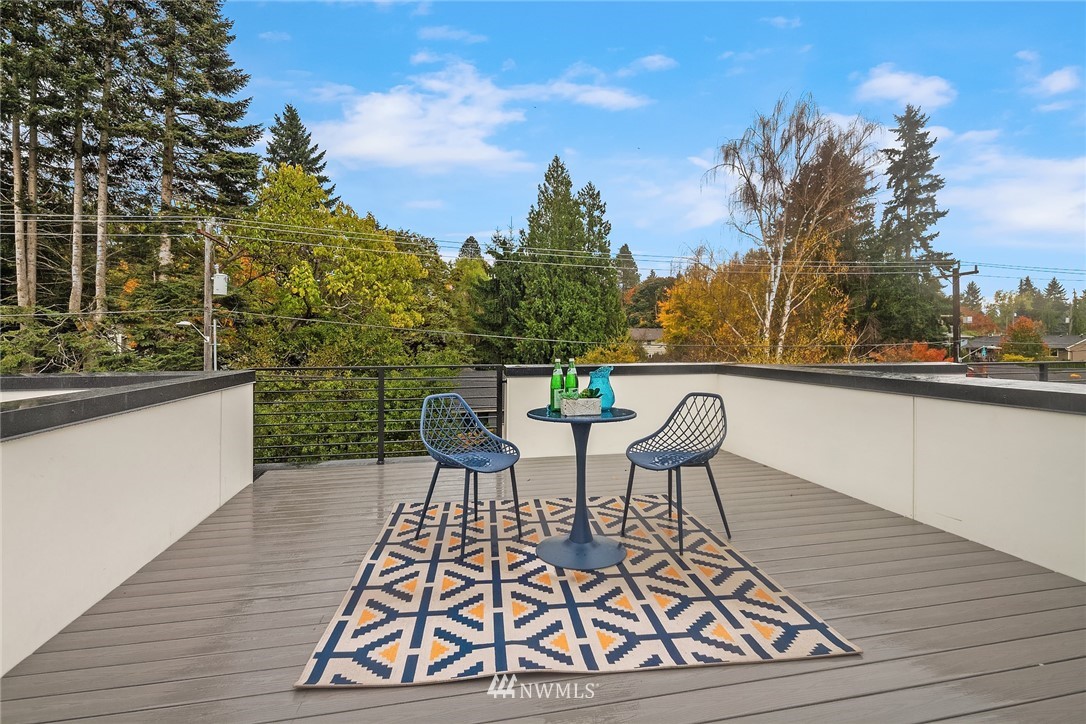 13735 35th Avenue Northeast, Unit B Seattle, WA 98125 - Photo 19 of 20 a view of a chairs and table on the deck