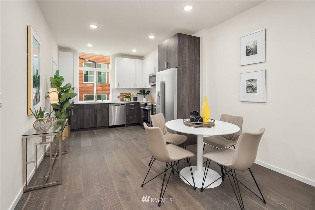 13735 35th Avenue Northeast, Unit B Seattle, WA 98125 - Photo 5 of 20 a view of a dining room with furniture window and wooden floor