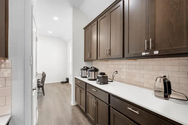 a kitchen with sink cabinets and window