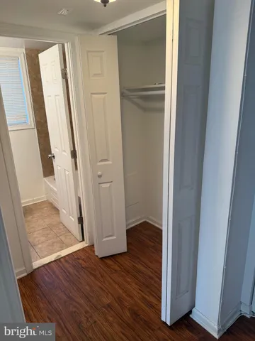 a view of front door with wooden floor