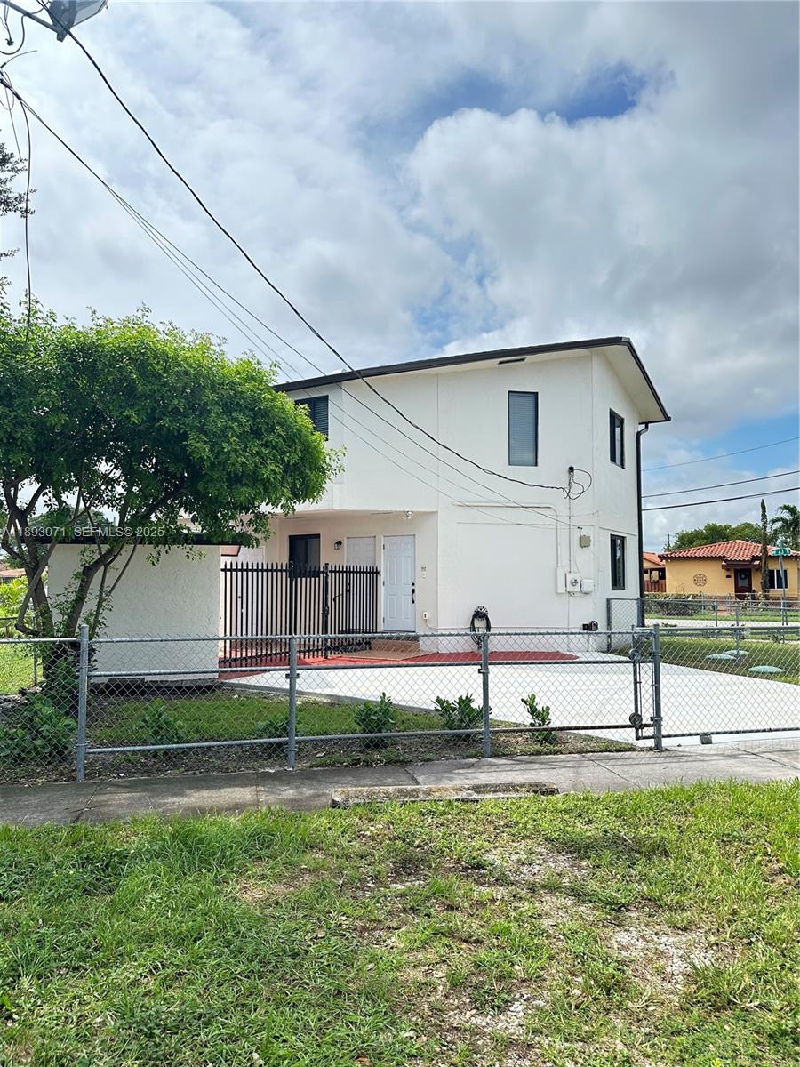 97 Northwest 73rd Place, Unit 12 Miami, FL 33126 - Photo 20 of 20 a front view of house with yard and green space