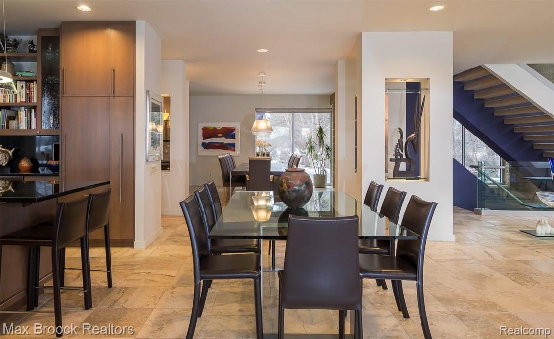 4455 Dow Ridge Road West Bloomfield, MI 48324 - Photo 15 of 50 View from the sunroom to the dining room. You can comfortably seat 30 without bringing out another table.