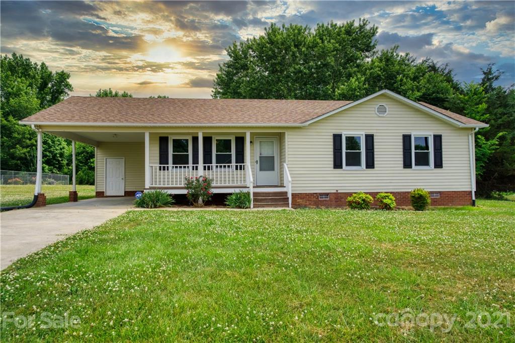 a house that has tree in front of it