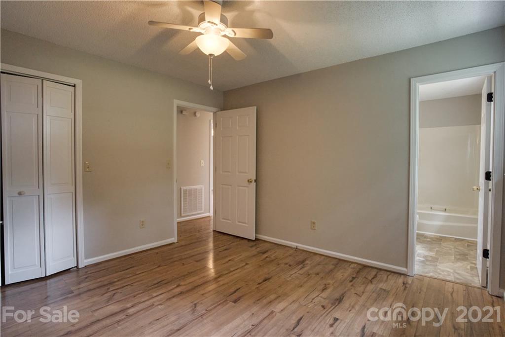 2345 Sides Road Rockwell, NC 28138 - Photo 11 of 19 an empty room with wooden floor closet and windows