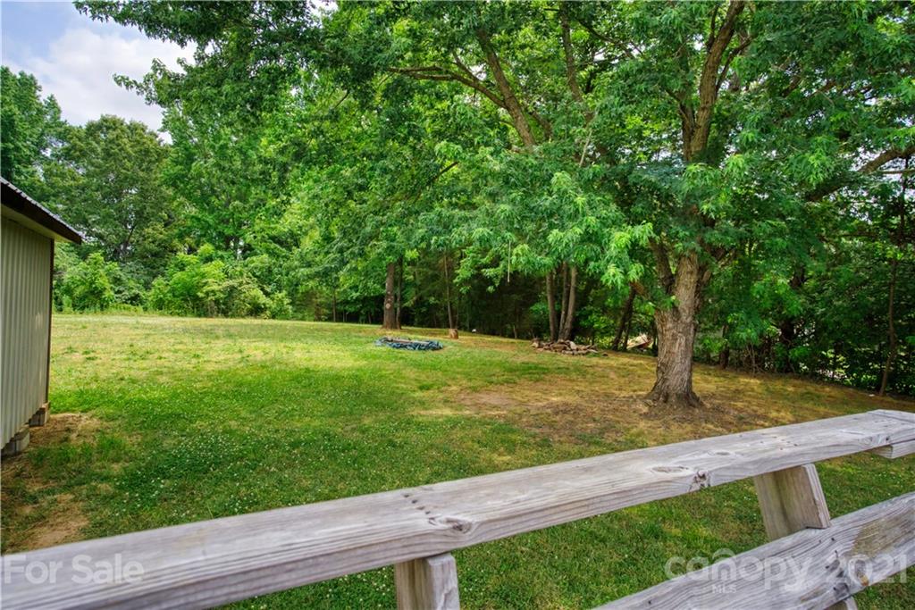 2345 Sides Road Rockwell, NC 28138 - Photo 13 of 19 a view of a backyard with large trees