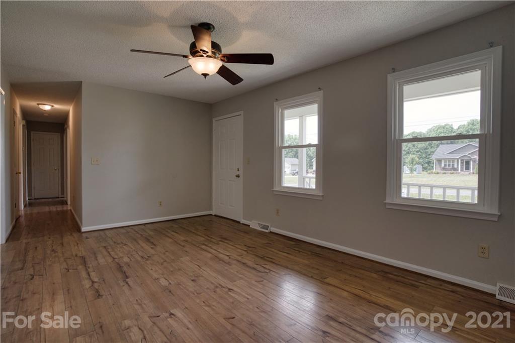 2345 Sides Road Rockwell, NC 28138 - Photo 4 of 19 a view of an empty room with wooden floor and a window