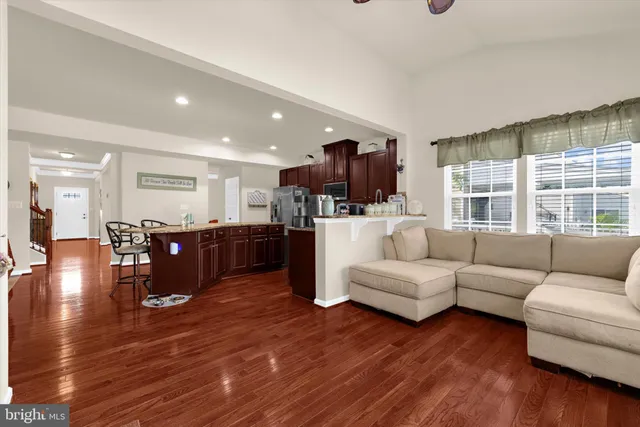 a view of a workspace with furniture and a flat screen tv