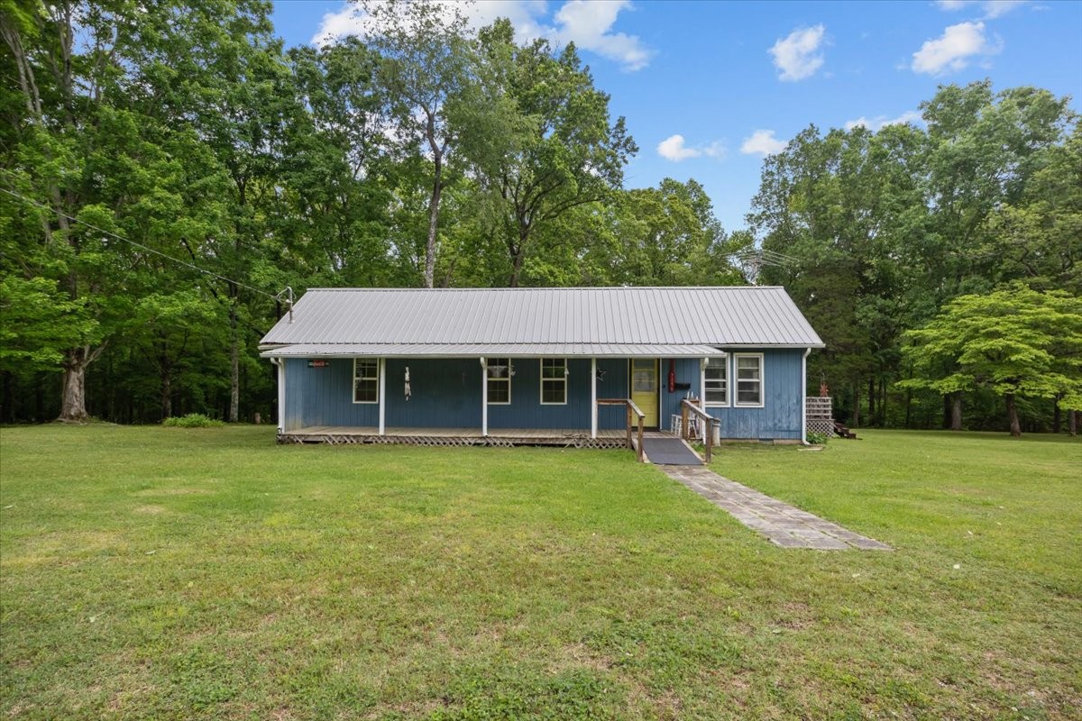 7158 Bahne Road Fairview, TN 37062 - Photo 1 of 37 a front view of a house with a garden