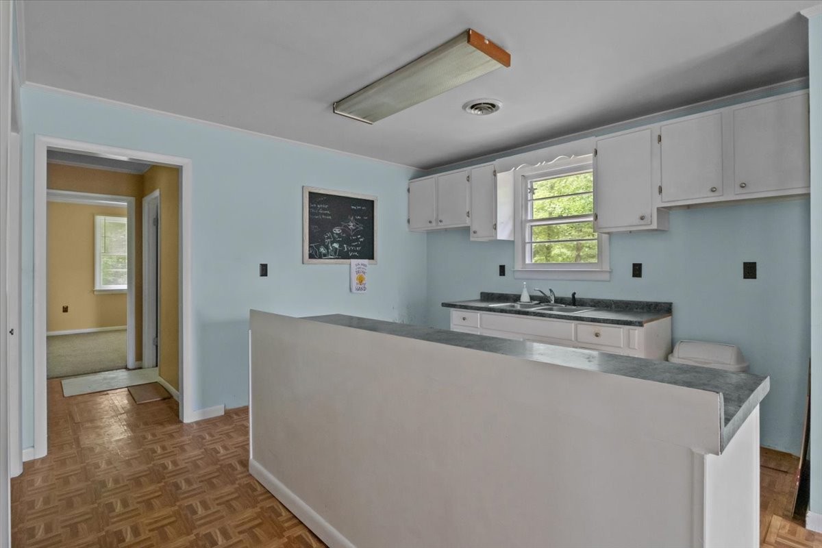7158 Bahne Road Fairview, TN 37062 - Photo 11 of 37 a kitchen with stainless steel appliances a stove a sink and a refrigerator