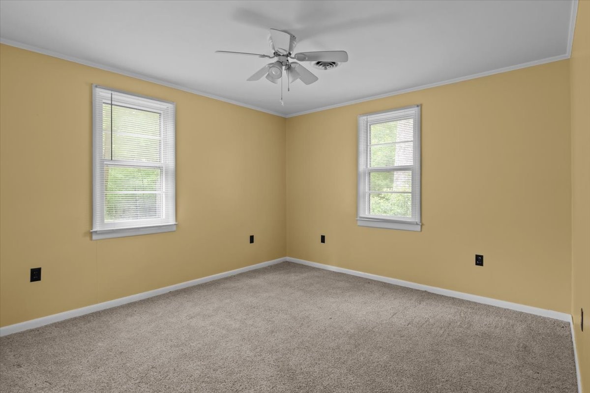 7158 Bahne Road Fairview, TN 37062 - Photo 20 of 37 a view of a room with windows and chandelier fan