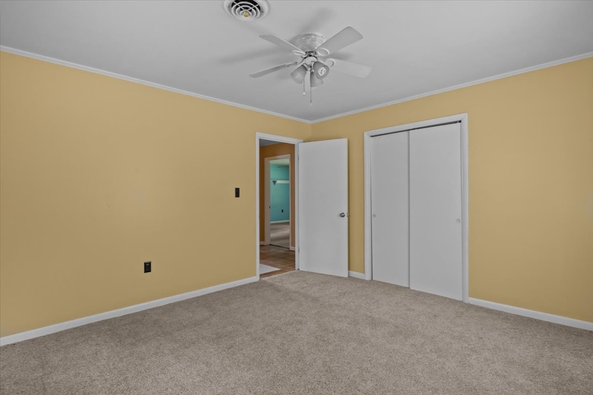 7158 Bahne Road Fairview, TN 37062 - Photo 21 of 37 a view of a chandelier with a ceiling fan