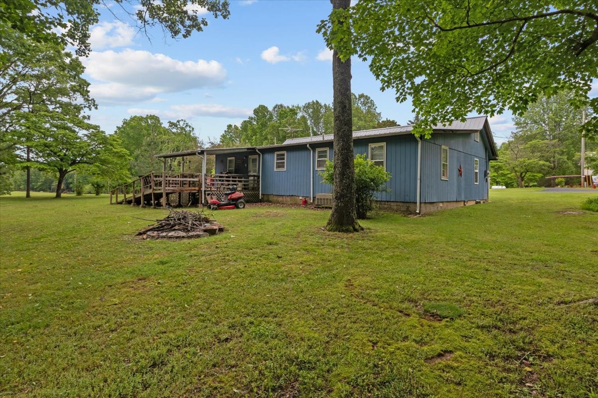 7158 Bahne Road Fairview, TN 37062 - Photo 34 of 37 a view of a backyard with a garden and trees